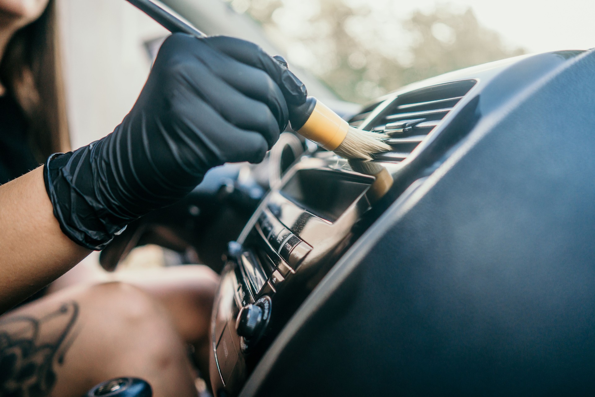 Professional car detailer at work